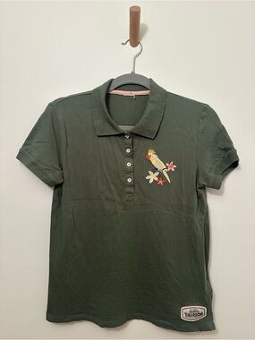 Disney Embroidered Walt’s Enchanted Tiki Room Green Polo